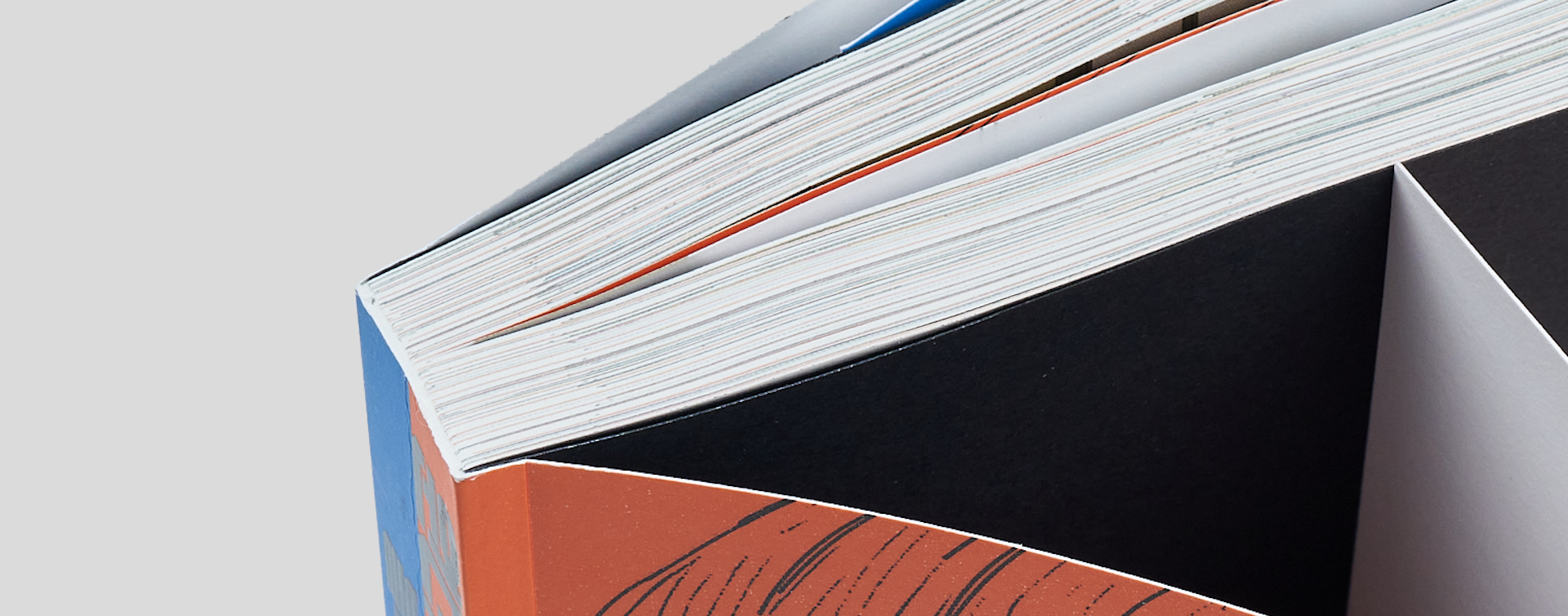 Close-up of the softcover comic book spine, highlighting the precise and durable binding quality