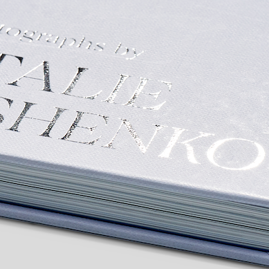 Foil stamping being applied to a book cover during the finishing process at the inclpress factory