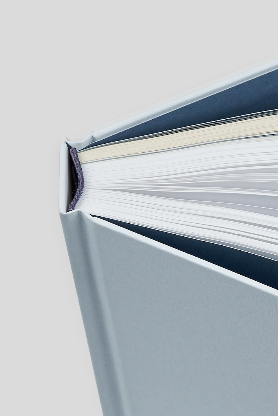 Close-up of a hardcover book spine, showcasing strong and premium case binding at inclpress