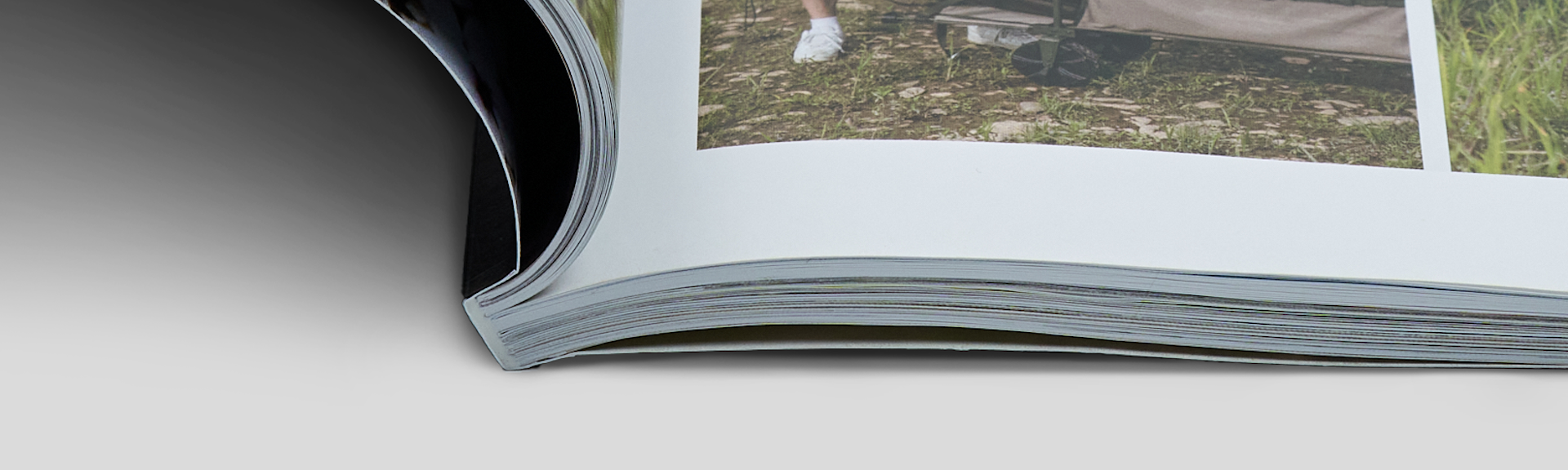 Close-up of a softcover book spine showing clean and professional perfect binding finish