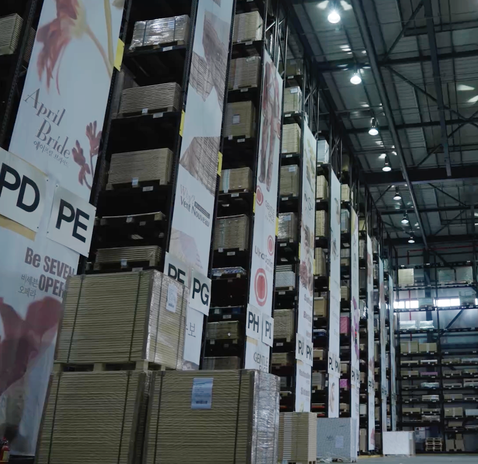 Paper warehouse at inclpress with stacks of premium Korean, European, and U.S. paper for commercial printing