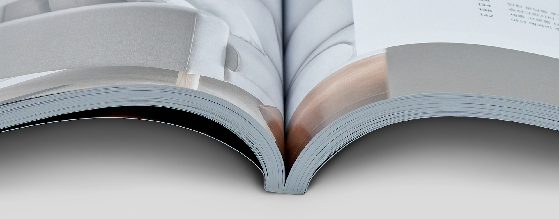 Close-up of magazine spine highlighting high-quality binding and alignment